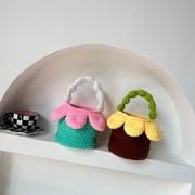 韩版儿童手提包时尚宝宝手工编织毛线零食包小女孩可爱花瓣配饰包