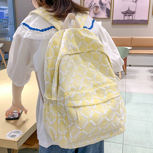 奶黄色书包女大容量大学生简约背包初中高中生女生原创小众双肩包
