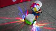 儿童特技三轮车吊车头，360度旋转音乐灯光电动玩具