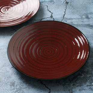 某牌孤品釉下彩红色，跳西餐盘高端新骨瓷(新骨瓷)创意平盘