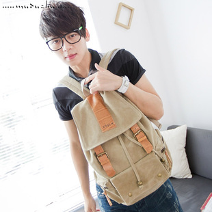  木独猪韩版男包牛皮加厚帆布包休闲男女背包学生双肩书包 包邮